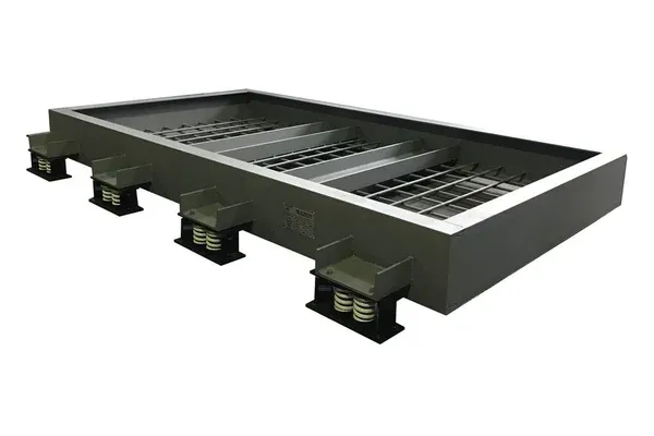 AIB-W welded inertia base frame: steel channel perimeter with reinforcing mesh and side brackets carrying spring isolators