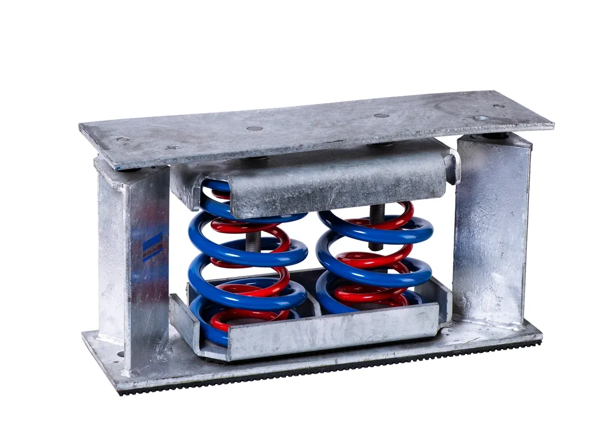 Hot-dip galvanised tailor-made seismic isolator with twin nested springs between a heavy top plate and a base plate